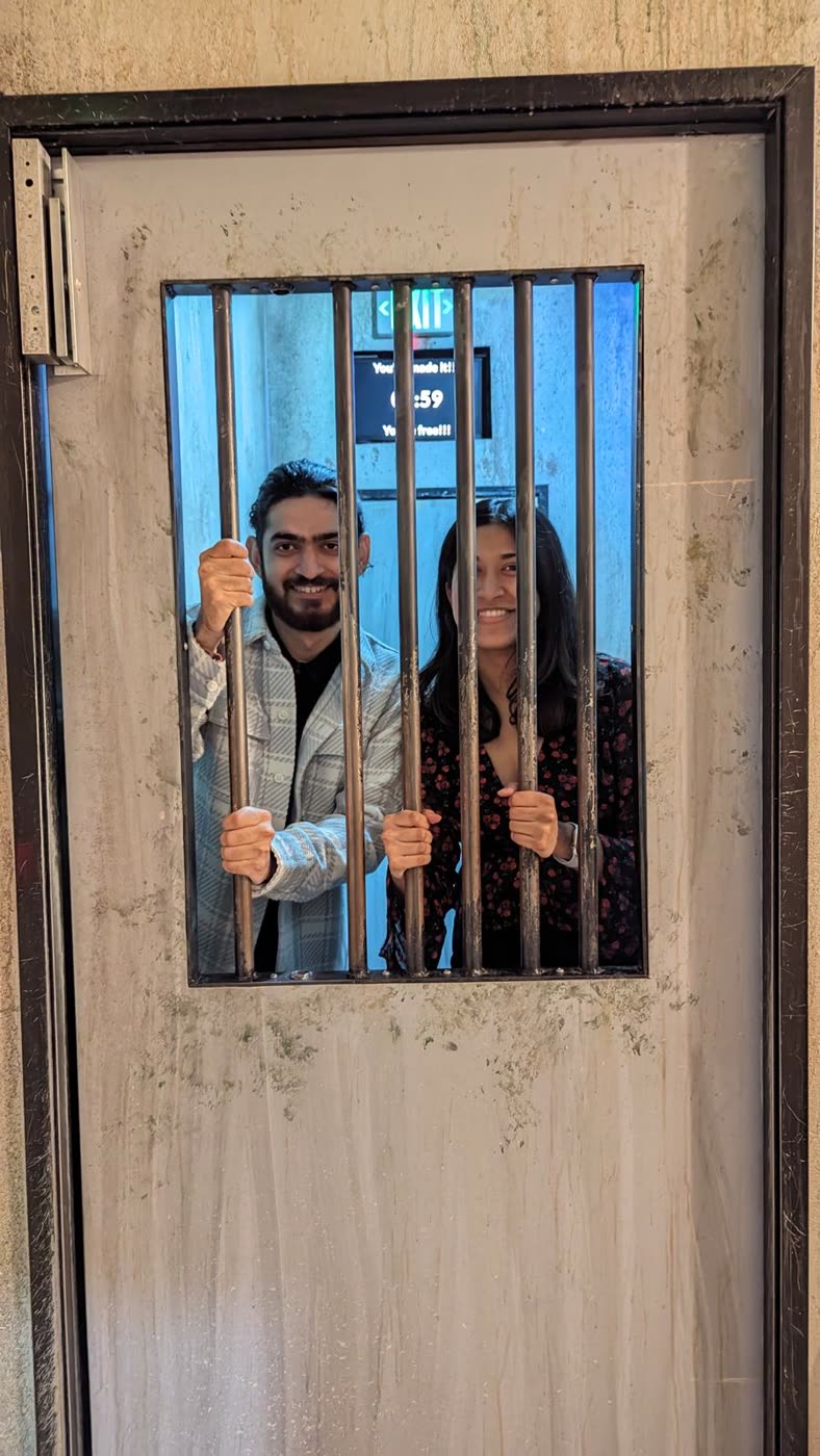 Abirami and Prateek framed in a blue window