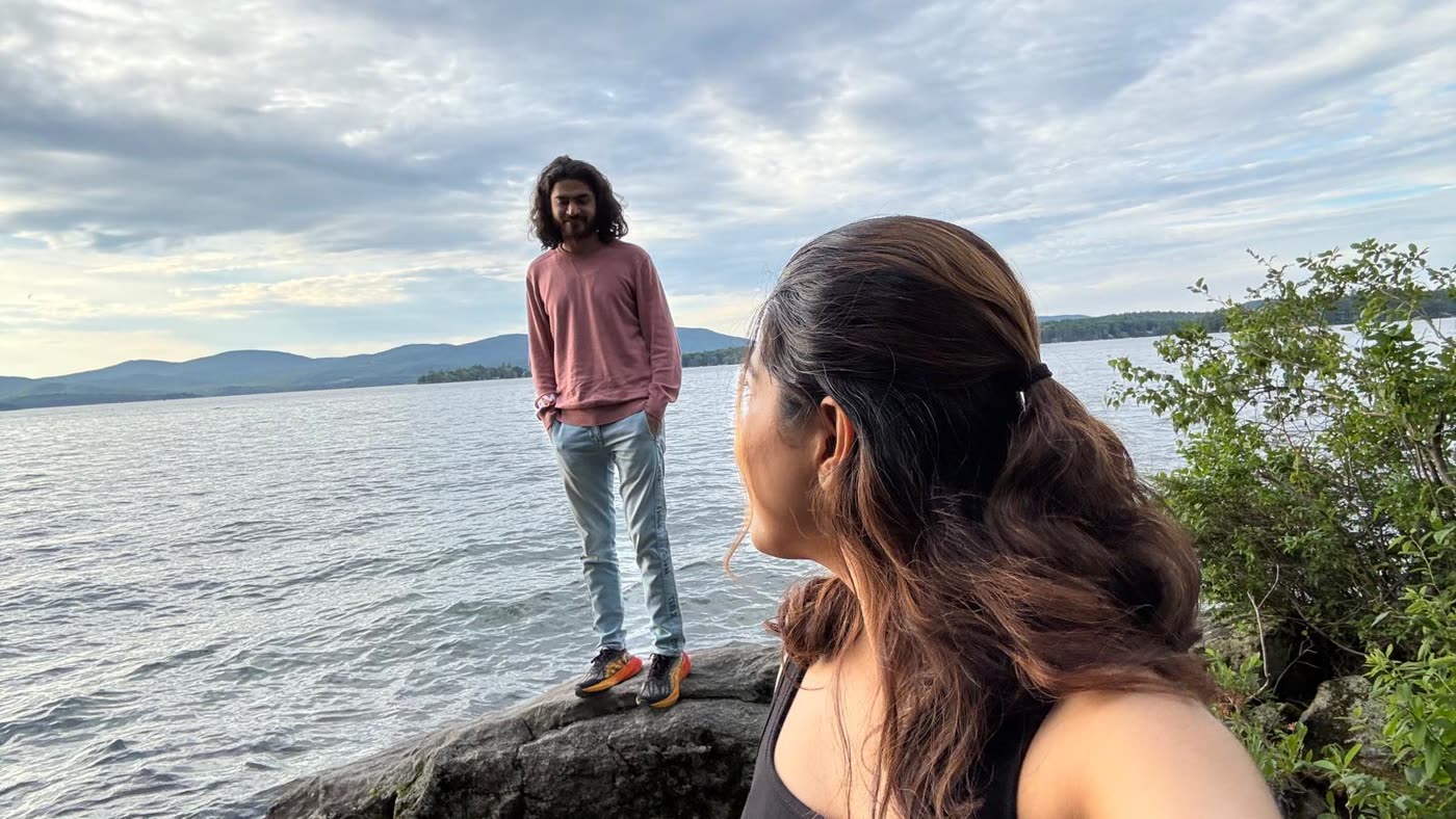 Abirami and Prateek at the edge of a lake