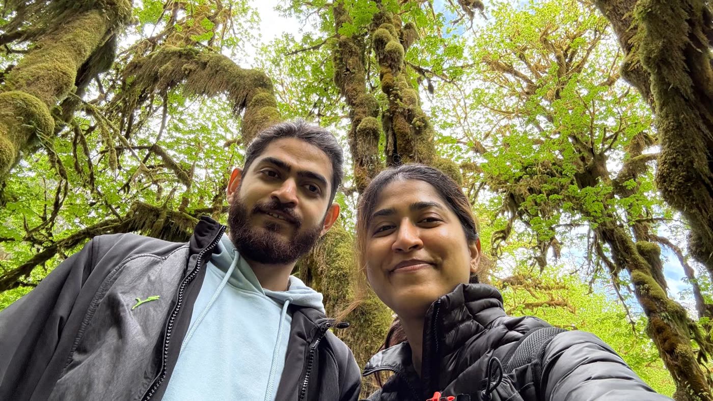 Abirami and Prateek in a mossy rainforest