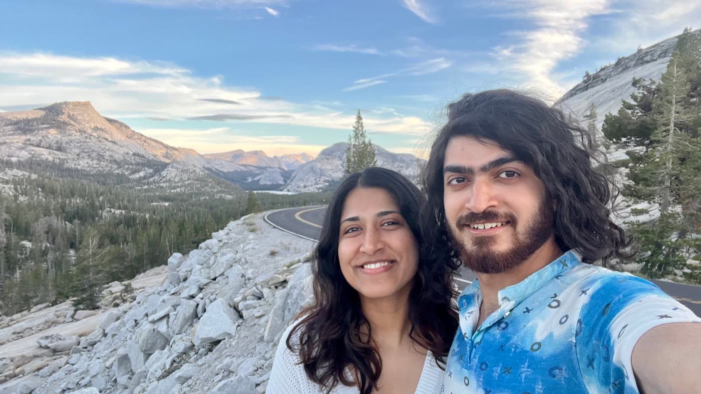 Abirami and Prateek on a mountain ridge